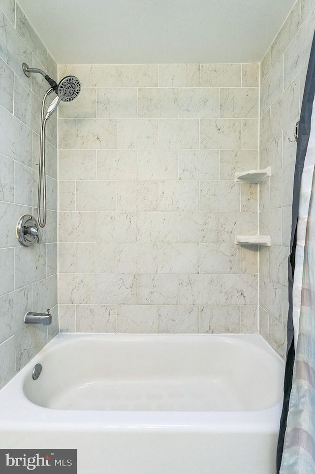 bathroom featuring shower / tub combo with curtain