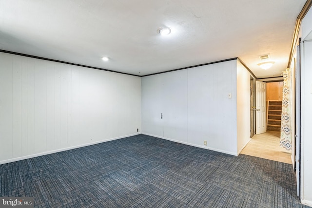 interior space with visible vents, crown molding, stairway, and carpet flooring