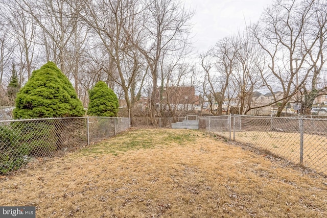 view of yard with a fenced backyard