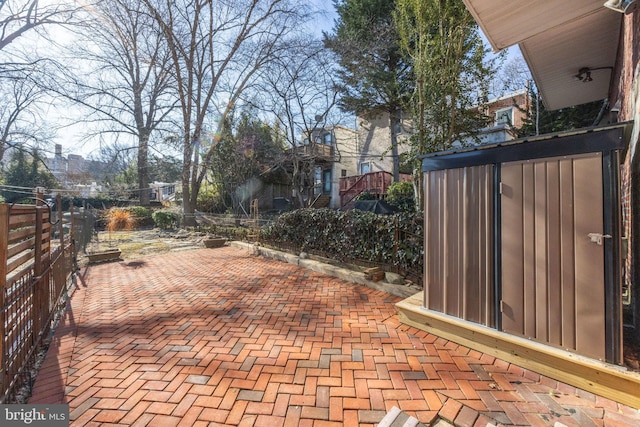 view of patio featuring fence