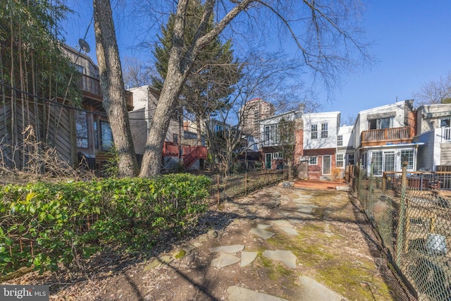 view of property's community with fence