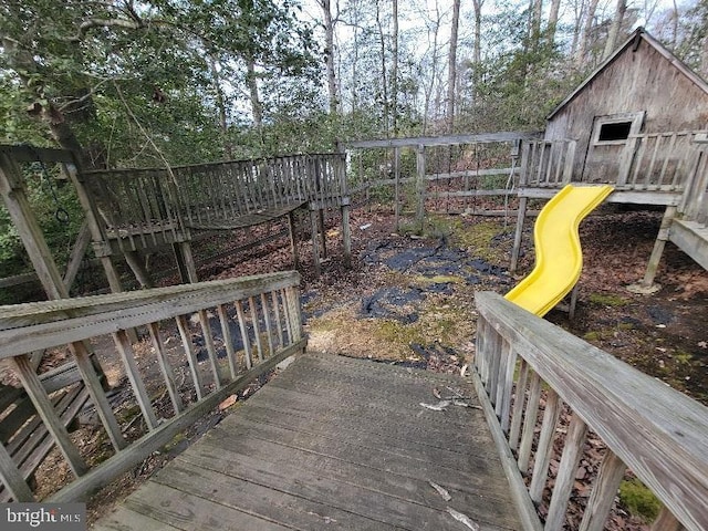 wooden terrace with a playground