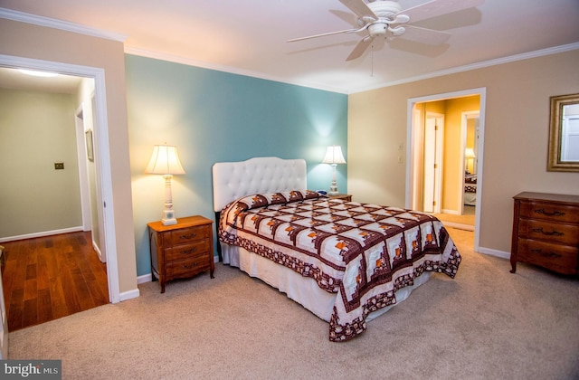 bedroom with baseboards, ornamental molding, and carpet flooring