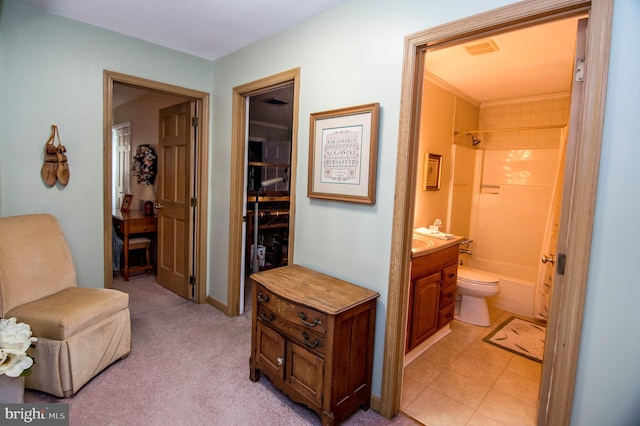 corridor featuring light tile patterned floors