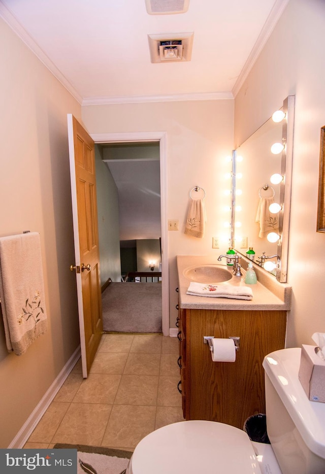 bathroom featuring tile patterned floors, toilet, vanity, and ornamental molding