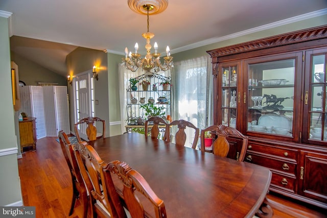 dining area with baseboards, an inviting chandelier, wood finished floors, and ornamental molding