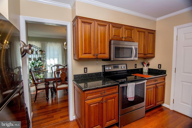 kitchen featuring dark wood-style floors, brown cabinetry, and stainless steel appliances