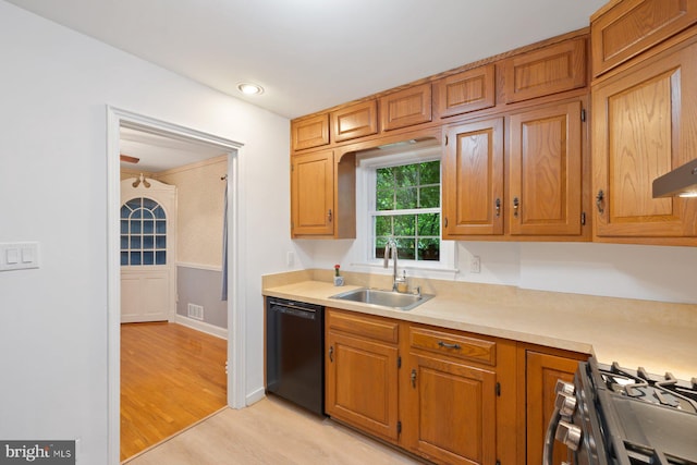 10402 Hayes Ave, Silver Spring, MD 20902 - kitchen with a sink, dishwasher, gas range, light countertops, and light wood-type flooring