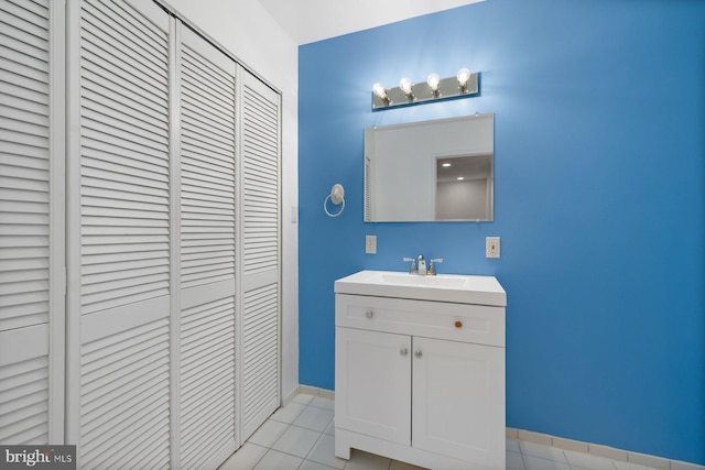 10402 Hayes Ave, Silver Spring, MD 20902 - bathroom with a closet, tile patterned flooring, vanity, and baseboards