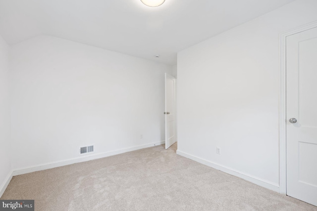 10402 Hayes Ave, Silver Spring, MD 20902 - spare room featuring light colored carpet, baseboards, and lofted ceiling