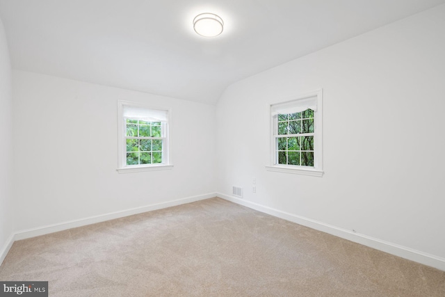 10402 Hayes Ave, Silver Spring, MD 20902 - spare room featuring carpet, lofted ceiling, and baseboards