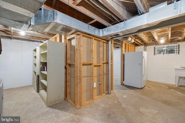 10402 Hayes Ave, Silver Spring, MD 20902 - unfinished below grade area featuring freestanding refrigerator and a sink