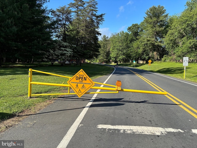 10402 Hayes Ave, Silver Spring, MD 20902 - view of asphalt road with traffic signs and view of scattered trees