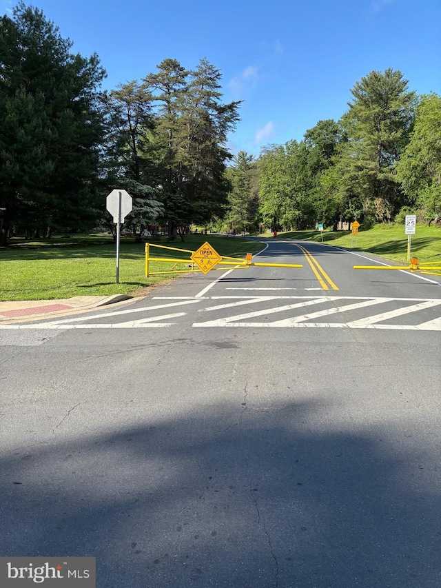 10402 Hayes Ave, Silver Spring, MD 20902 - view of asphalt street with traffic signs and view of scattered trees
