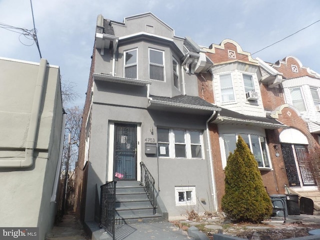 multi unit property featuring entry steps and stucco siding