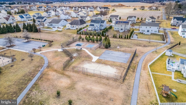 birds eye view of property with a residential view