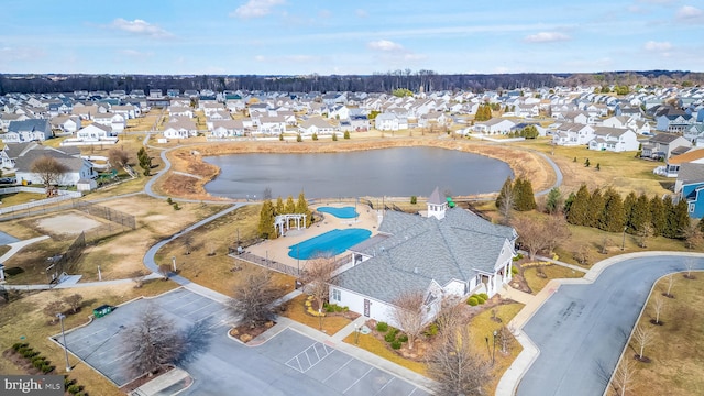 birds eye view of property featuring a residential view and a water view