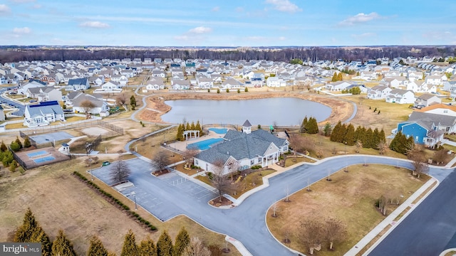 bird's eye view with a residential view and a water view