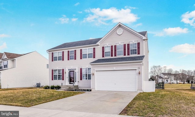 view of front of property with driveway, central AC unit, an attached garage, fence, and a front lawn