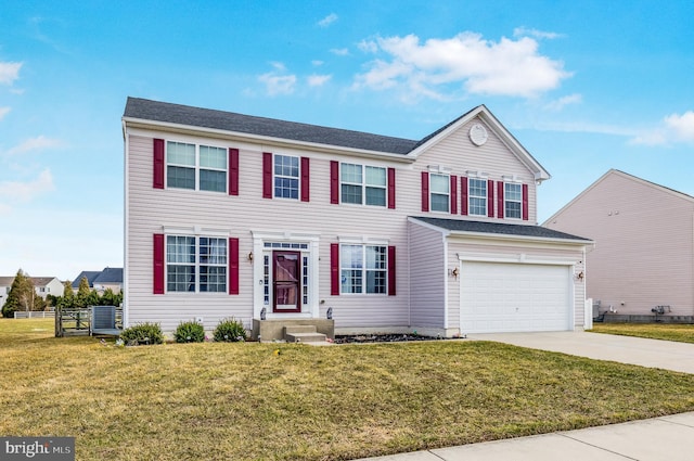 view of front of house featuring driveway, a garage, fence, cooling unit, and a front yard