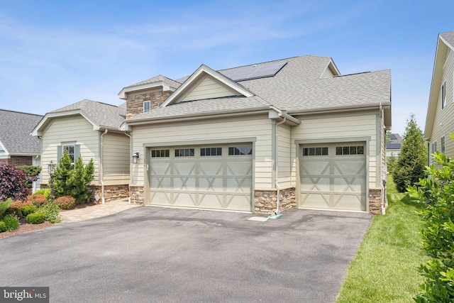 114 Cloak Ln, Lake Frederick, VA 22630 - craftsman house with stone siding, driveway, a garage, and roof with shingles