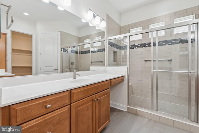 114 Cloak Ln, Lake Frederick, VA 22630 - bathroom with vanity, a shower stall, tile patterned floors, a walk in closet, and recessed lighting