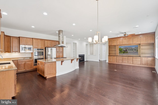 114 Cloak Ln, Lake Frederick, VA 22630 - kitchen with stainless steel appliances, island range hood, open floor plan, a sink, and dark wood-style floors