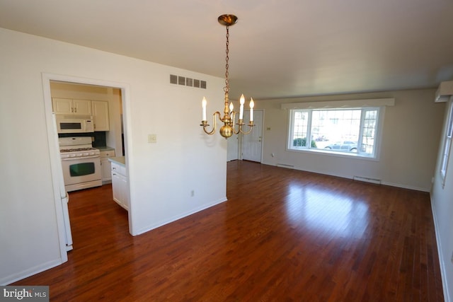 unfurnished dining area featuring visible vents, a baseboard heating unit, baseboards, a chandelier, and dark wood finished floors