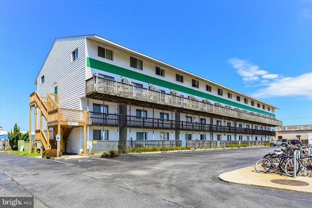 view of property with uncovered parking