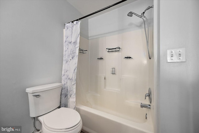 full bath featuring toilet and shower / tub combo with curtain