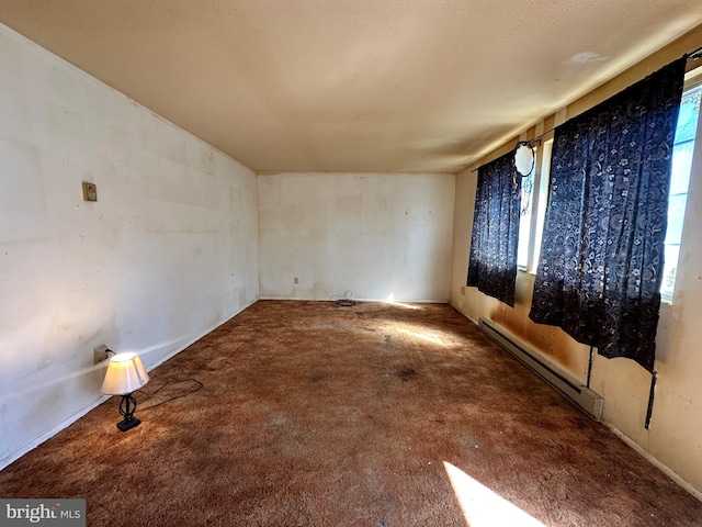 spare room featuring baseboard heating