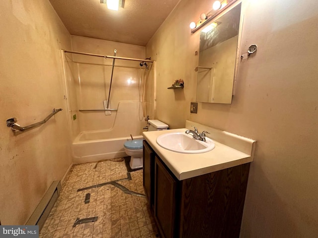 bathroom with toilet, vanity, baseboards, baseboard heating, and washtub / shower combination