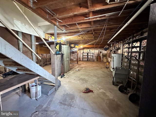 unfinished basement with gas water heater