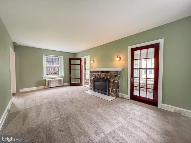 6 Washington Ave, Norristown, PA 19403 - unfurnished living room featuring radiator heating unit, carpet flooring, and plenty of natural light
