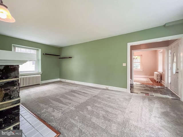 6 Washington Ave, Norristown, PA 19403 - unfurnished living room with radiator, carpet floors, and baseboards