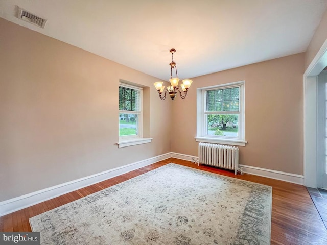 6 Washington Ave, Norristown, PA 19403 - empty room with radiator heating unit, a chandelier, plenty of natural light, and baseboards