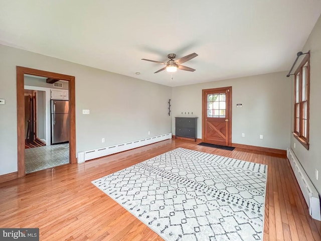 6 Washington Ave, Norristown, PA 19403 - entrance foyer with baseboard heating, a ceiling fan, baseboards, and light wood-style flooring