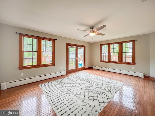 6 Washington Ave, Norristown, PA 19403 - empty room with baseboard heating, ceiling fan, and light wood-style flooring