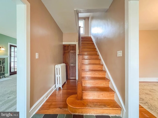 6 Washington Ave, Norristown, PA 19403 - stairs featuring radiator heating unit, wood finished floors, baseboards, and lofted ceiling