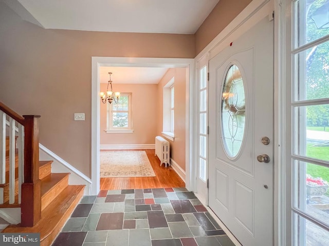 6 Washington Ave, Norristown, PA 19403 - foyer with radiator heating unit, a chandelier, stairway, baseboards, and dark wood-style floors