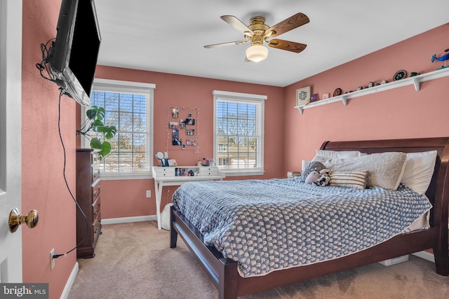 bedroom with baseboards, carpet, and a ceiling fan