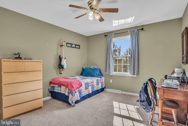 carpeted bedroom featuring baseboards and a ceiling fan