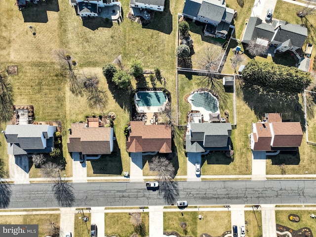 birds eye view of property with a residential view