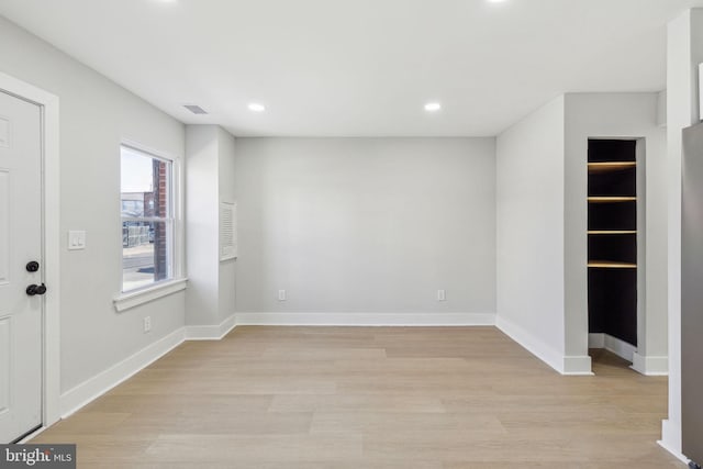 interior space featuring recessed lighting, visible vents, light wood-type flooring, and baseboards