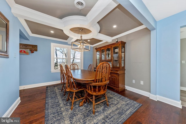 dining room featuring visible vents, baseboards, and hardwood / wood-style floors