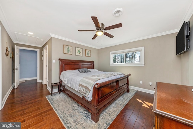 bedroom featuring visible vents, baseboards, dark wood finished floors, attic access, and ornamental molding