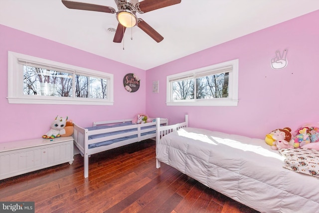 bedroom featuring visible vents, a ceiling fan, and hardwood / wood-style flooring