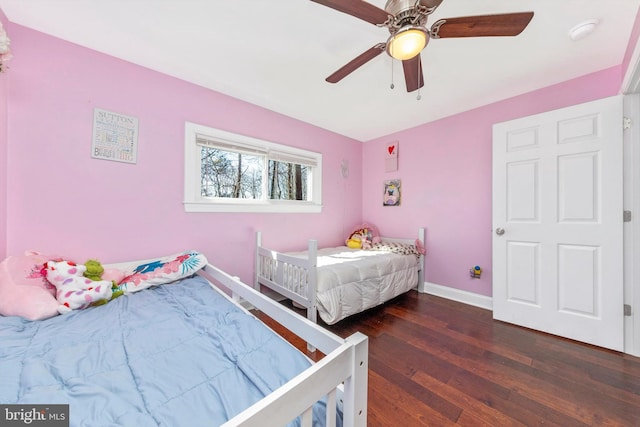 bedroom featuring hardwood / wood-style floors, baseboards, and ceiling fan