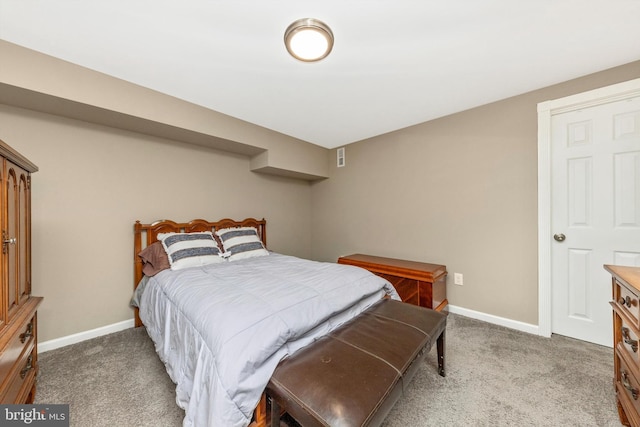 carpeted bedroom featuring visible vents and baseboards