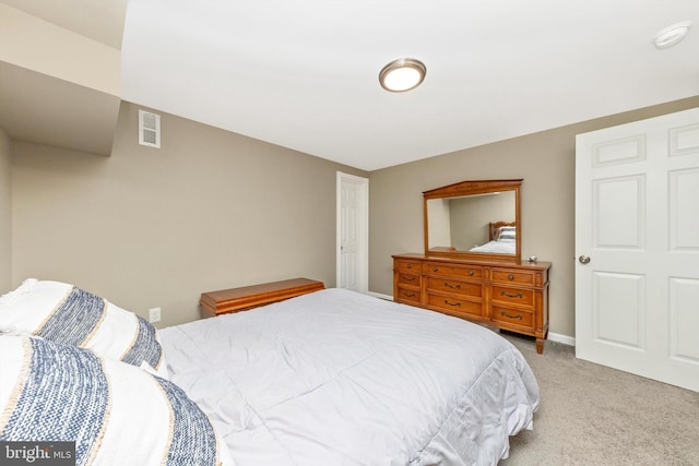 bedroom with visible vents, baseboards, and carpet flooring